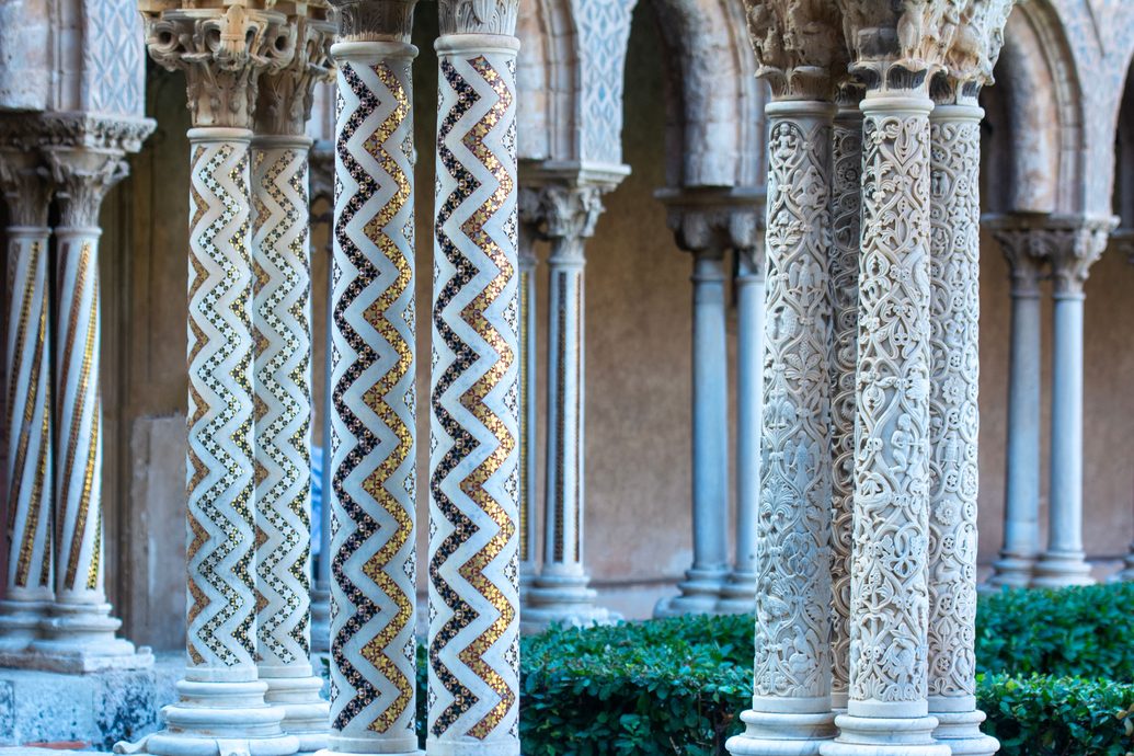Paired columns in the cloister of Monreale, carved and inlaid with mosaic in zigzag and spiral patterns