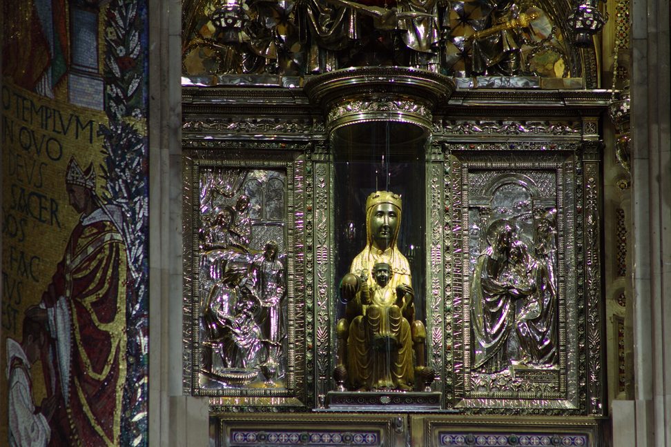 The dark-faced Romanesque statue of the Virgin and Child of Montserrat, La Moreneta, in her silver-framed niche