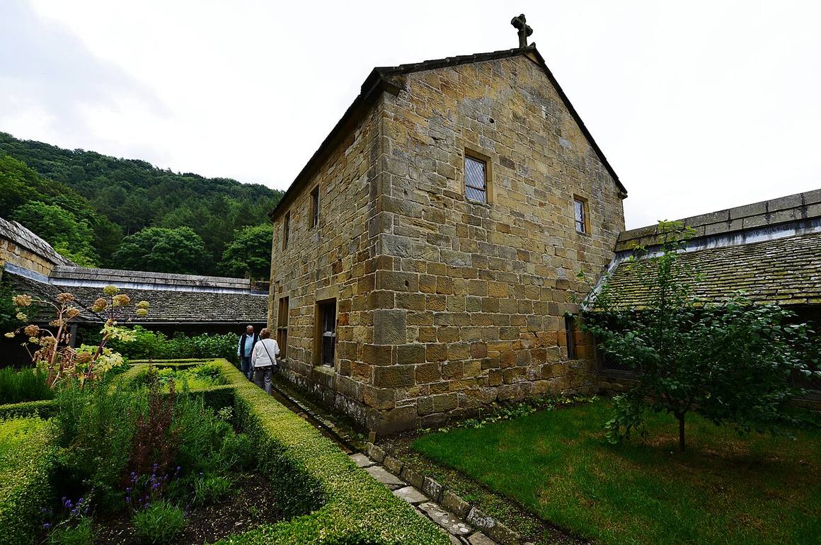 The reconstructed two-storey monk's cell at Mount Grace Priory with its walled garden