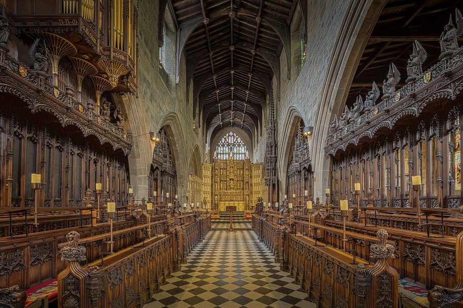 The quire of Newcastle Cathedral, with carved wooden stalls and the organ case, looking east to the reredos