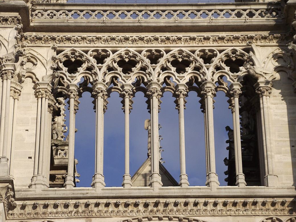 The open stone gallery of the chimeras high on the towers of Notre-Dame de Paris