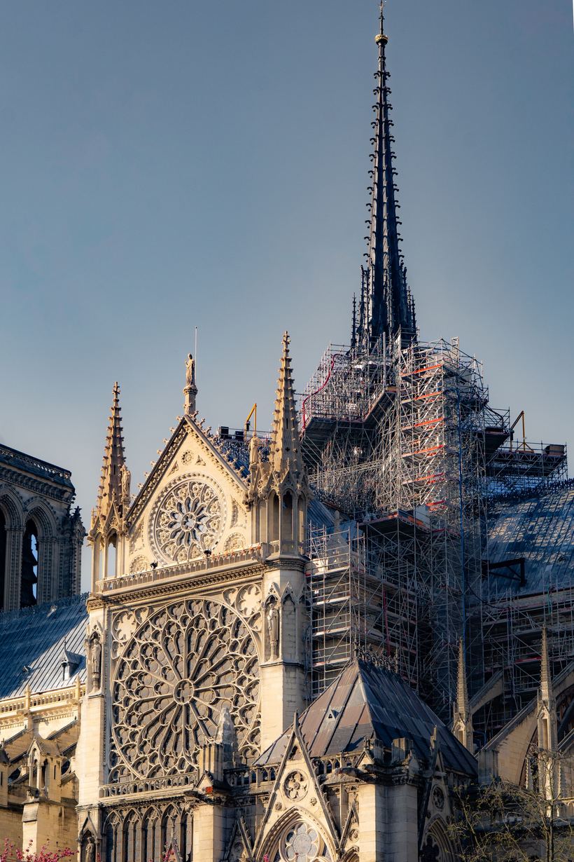 The rebuilt spire of Notre-Dame de Paris rising above the south transept