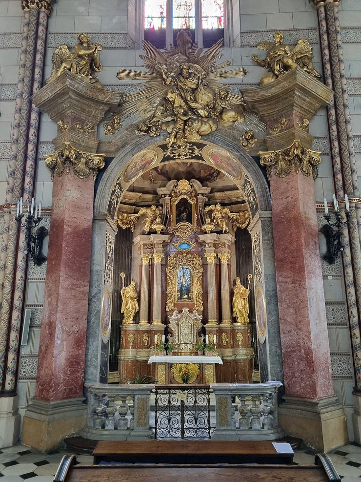 The Baroque altar of the Loreto chapel in Olomouc cathedral in red marble and gold