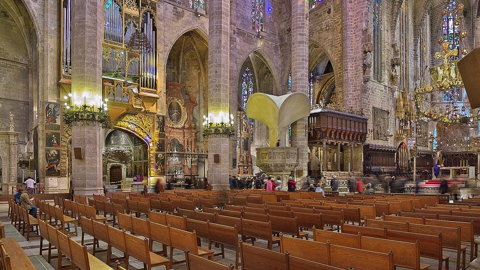 Rows of pews leading to the choir and royal chapel at the east end of Palma Cathedral