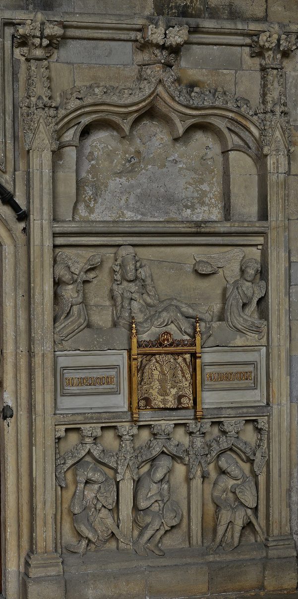 The carved stone Easter Sepulchre in the chancel at Patrington, with sleeping soldiers below the risen Christ