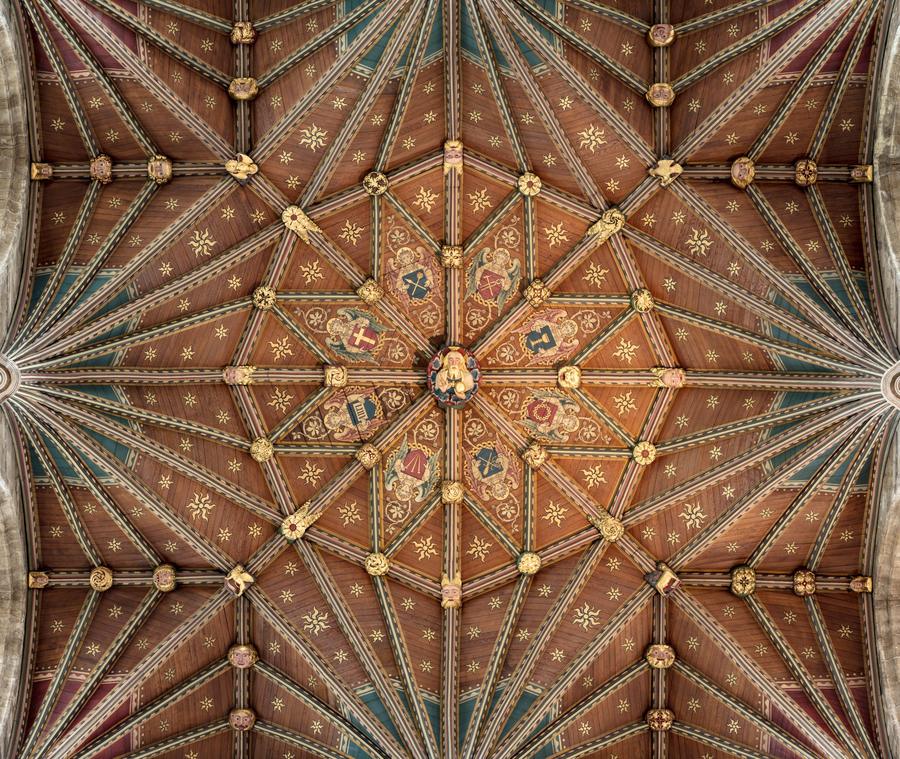 The painted wooden vault over the choir at Peterborough Cathedral with gilded bosses