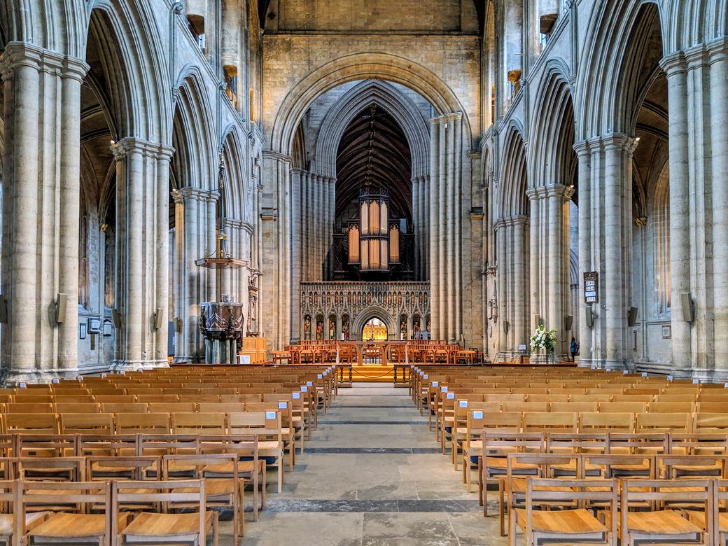 The nave of Ripon Cathedral looking east towards the crossing and the organ on the screen