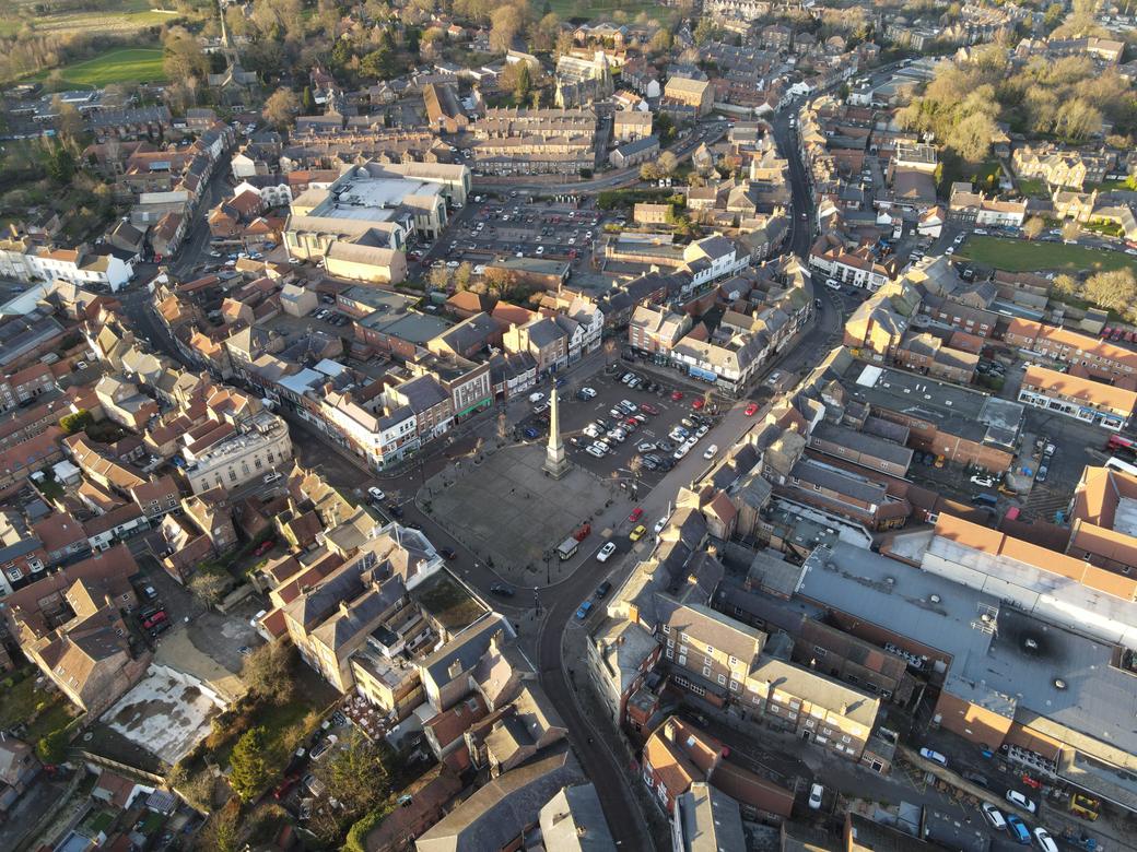 Aerial view of Ripon Market Square with its tall obelisk