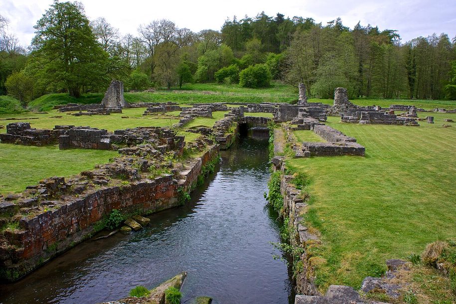 Maltby Beck running in a stone channel through the ruins of Roche Abbey