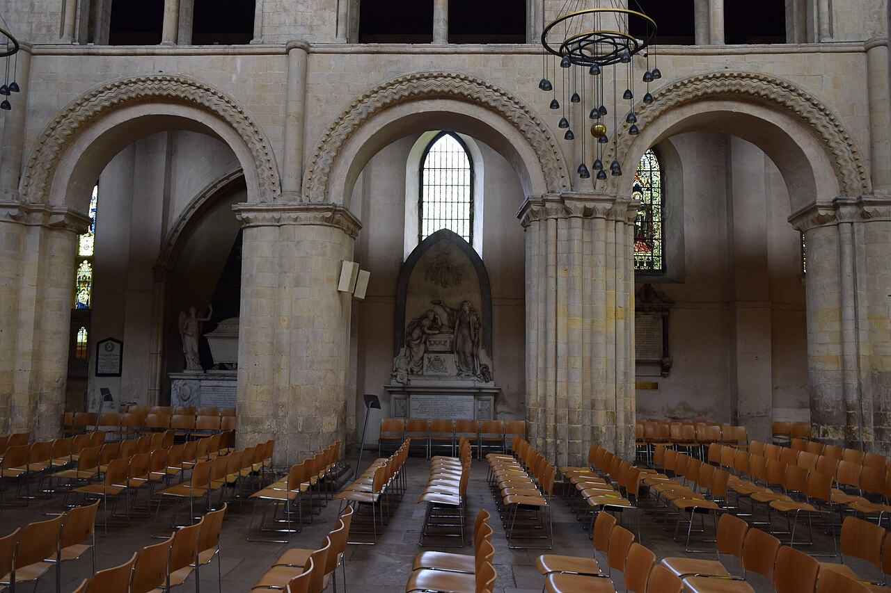 Round Norman arches and decorated piers in the nave of Rochester Cathedral