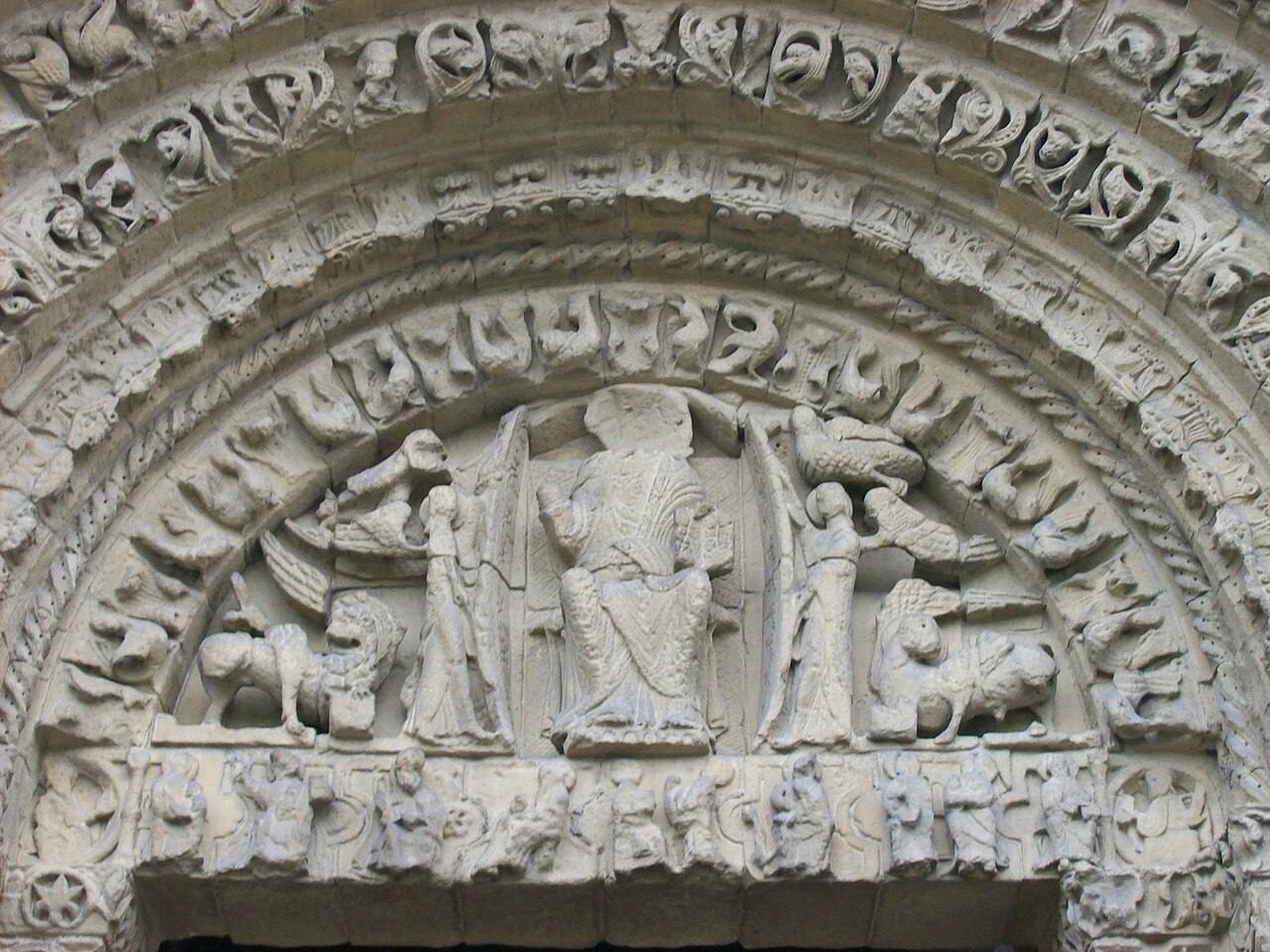The carved tympanum above the west door of Rochester Cathedral showing Christ in Majesty