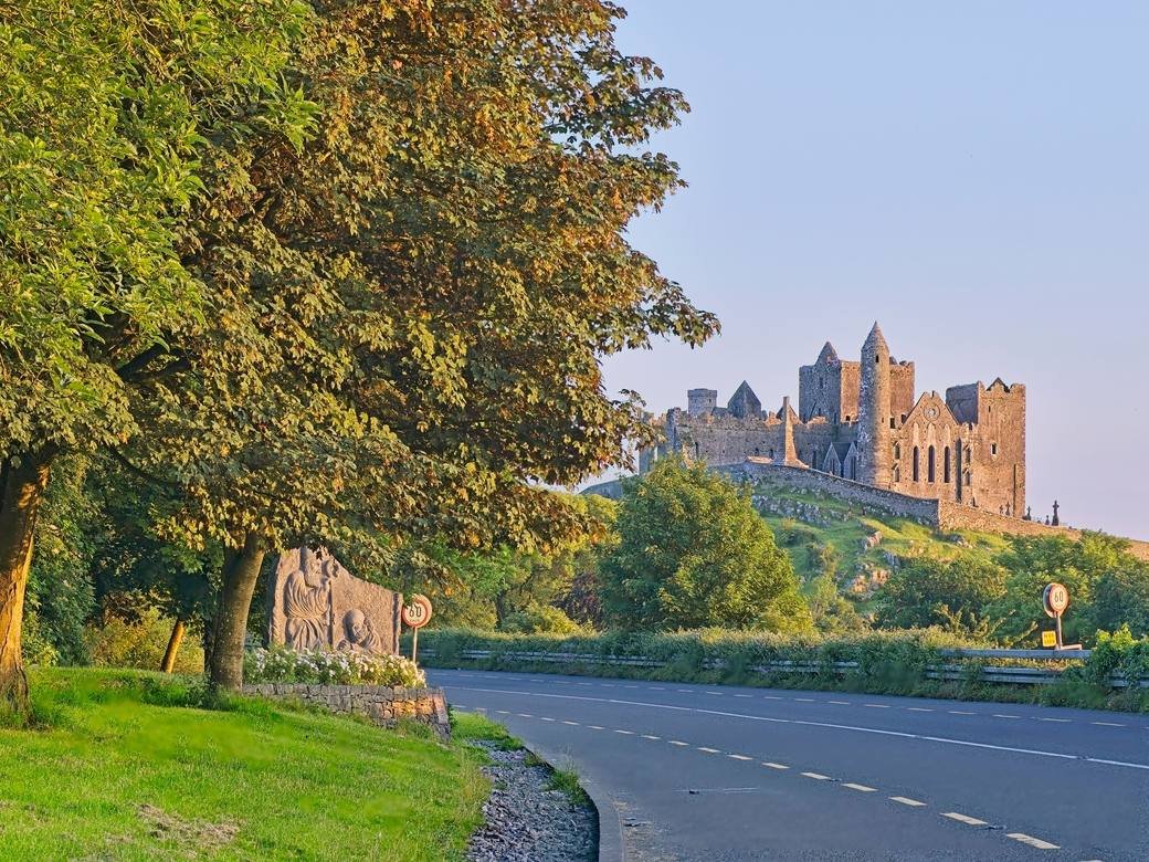 The Rock of Cashel seen from the road below, above green Tipperary countryside