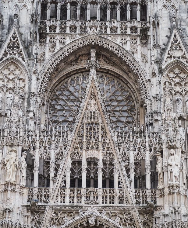 Close view of the openwork gable and tracery above the central portal of Rouen Cathedral