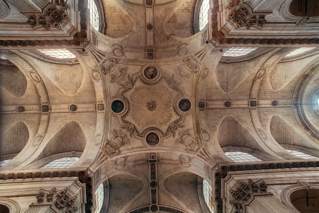 Looking up at the carved stone vault of Saint-Sulpice