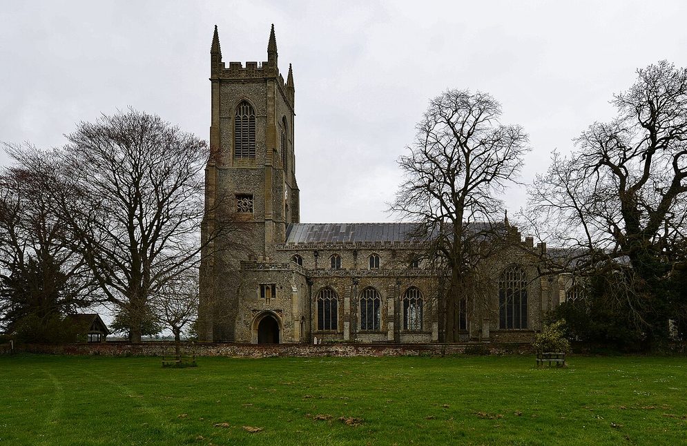 Salle church seen across the churchyard, a long Perpendicular church with a tall west tower