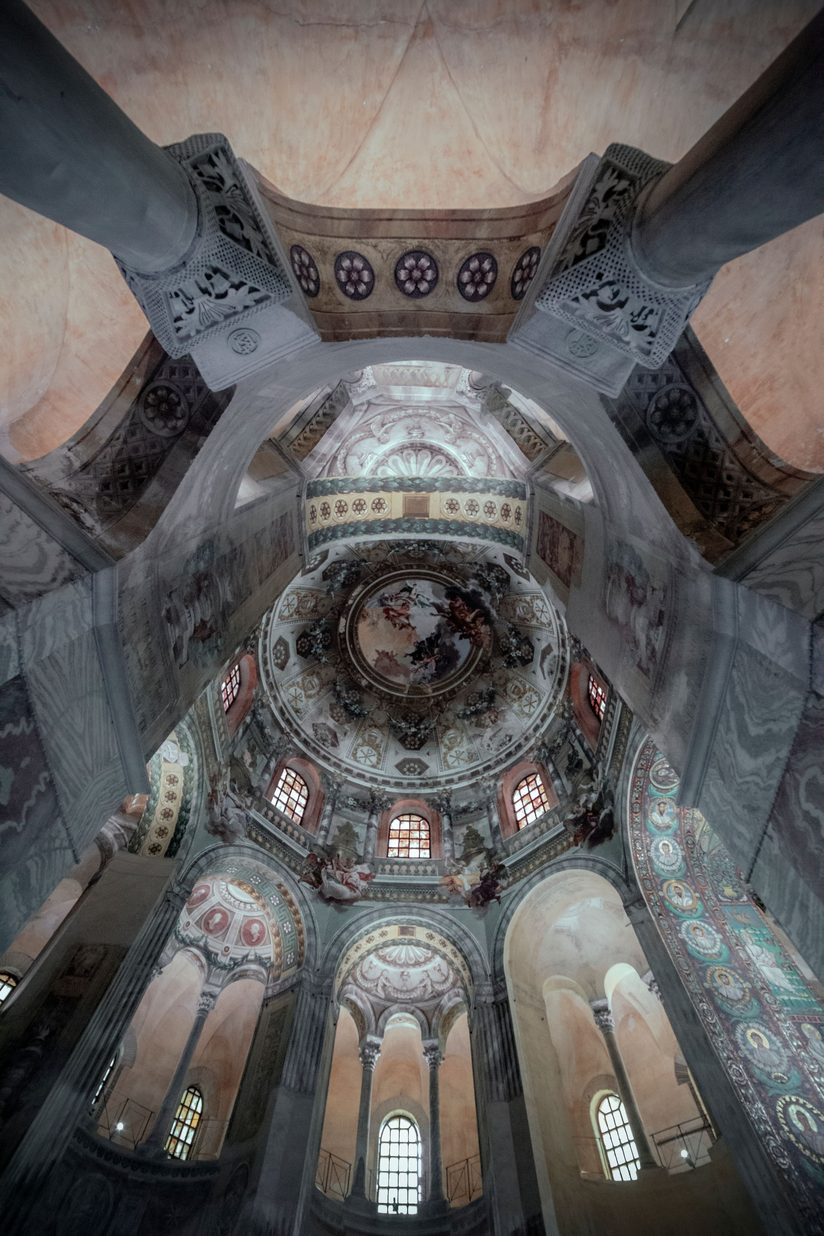 Looking up inside the octagon of San Vitale, with its arcades, gallery and painted dome
