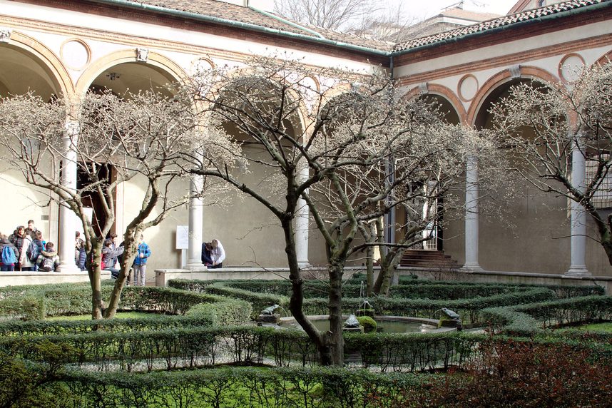 The small arcaded cloister of Santa Maria delle Grazie with a garden in the middle