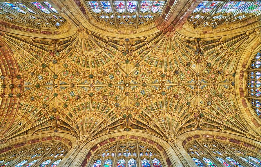 Looking straight up at the golden fan vault of Sherborne Abbey