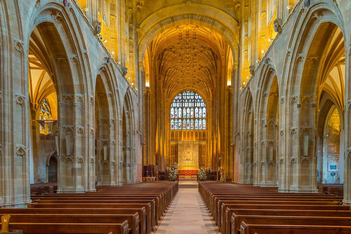 The interior of Sherborne Abbey looking east along the nave to the choir