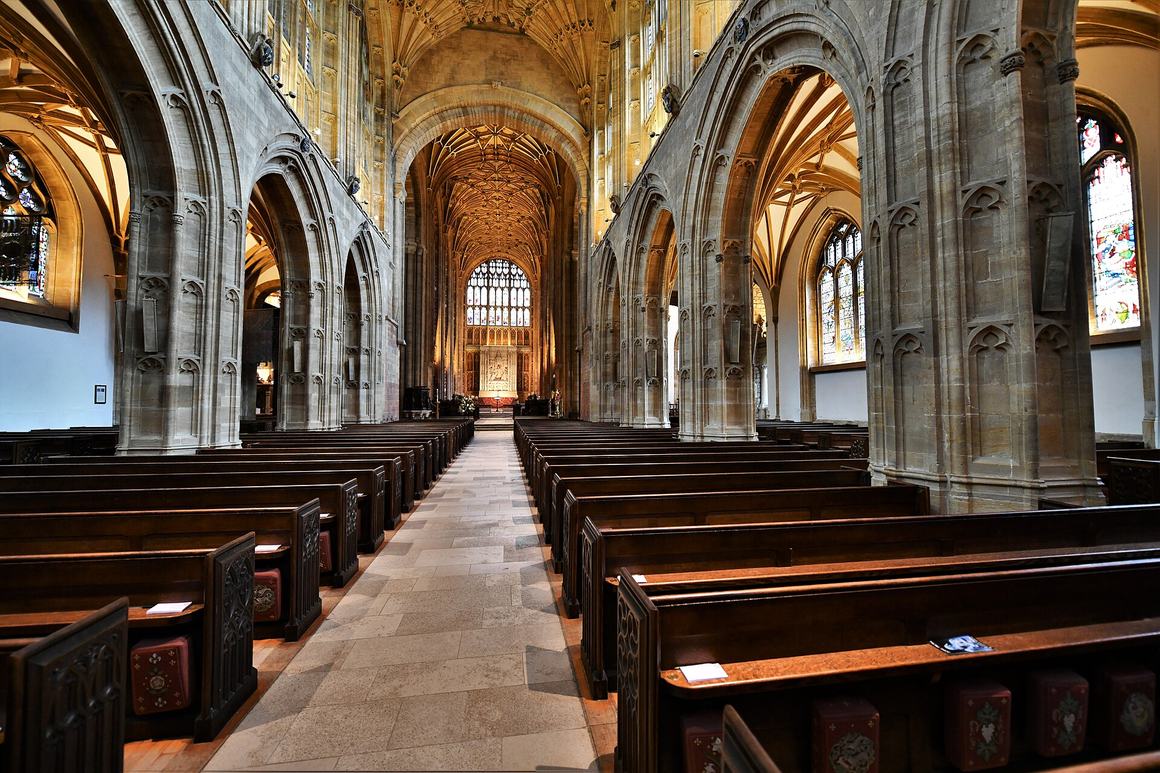 The nave of Sherborne Abbey under its fan vault, looking east
