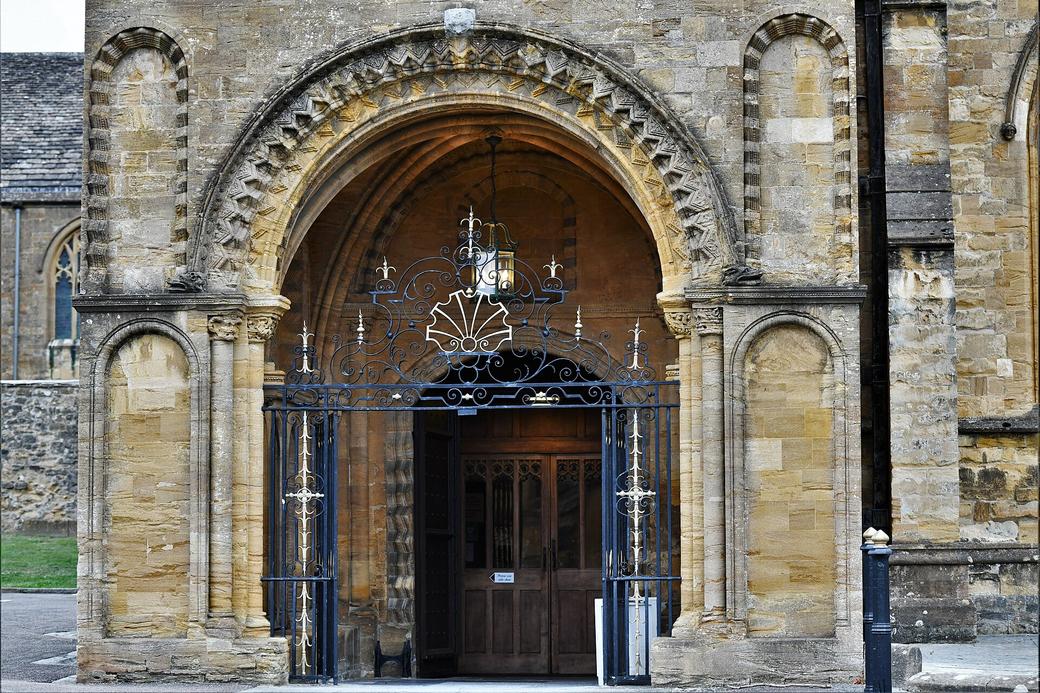 The Norman south porch of Sherborne Abbey with its round-arched doorway