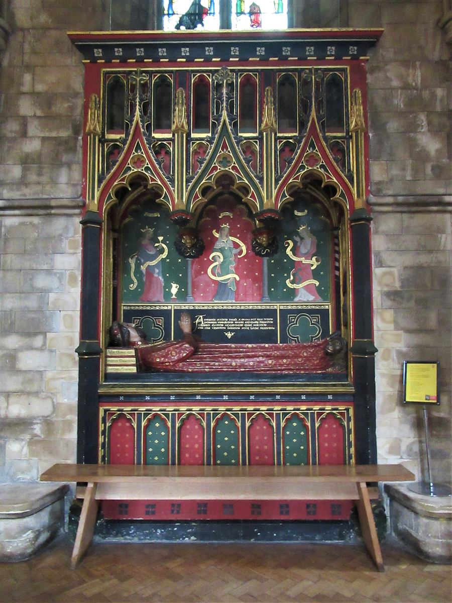 The brightly painted tomb of the poet John Gower, his effigy resting its head on three books