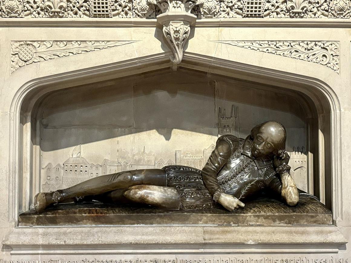 An alabaster figure of William Shakespeare reclining, with a relief of old Southwark behind