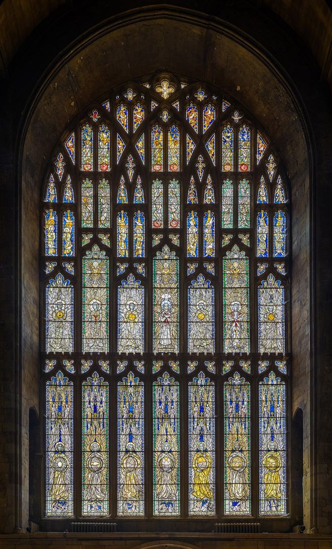 The modern west window of Southwell Minster filled with rows of angels in stained glass
