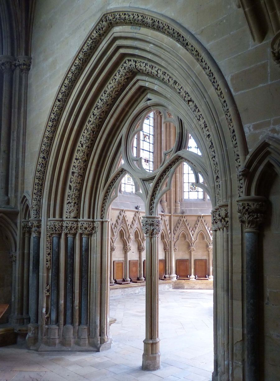 The carved double doorway into the chapter house at Southwell Minster, covered in stone foliage