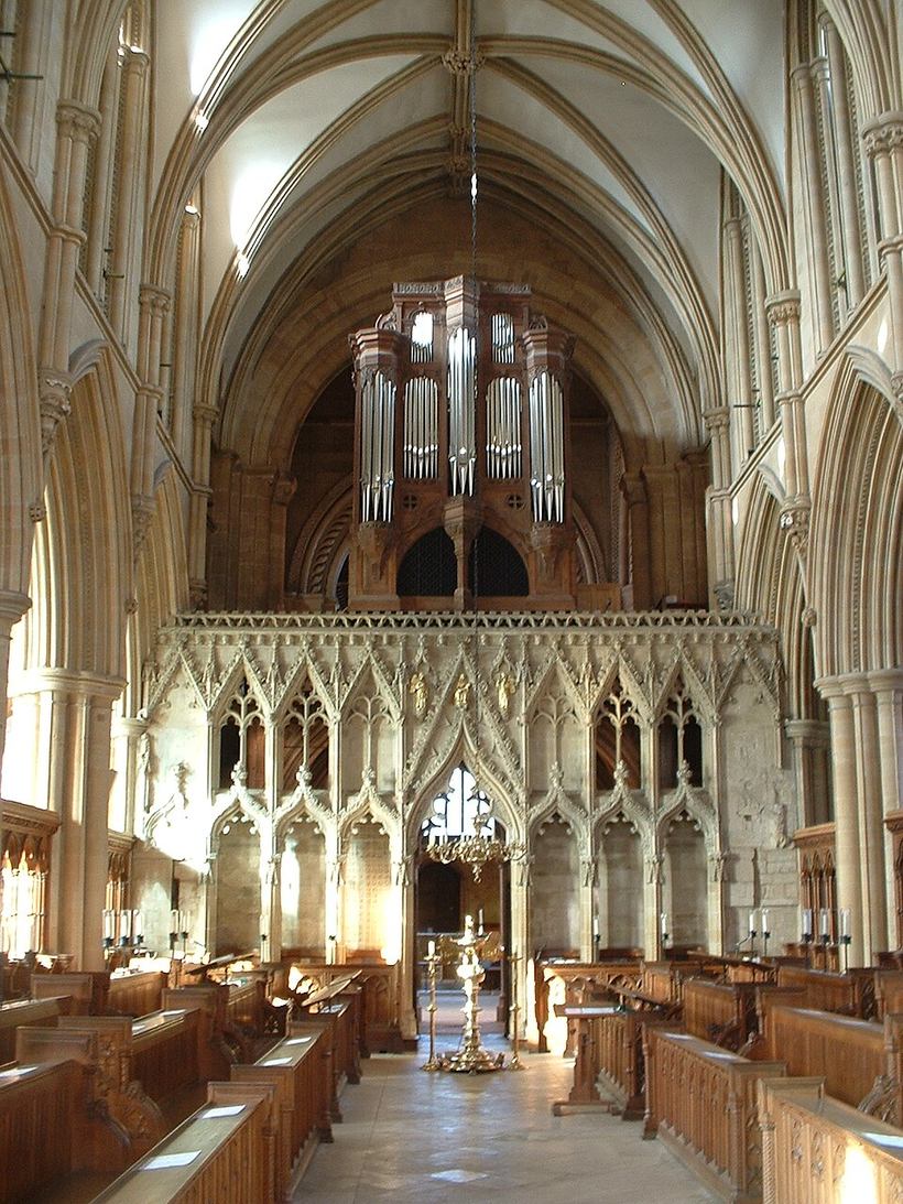 The carved stone pulpitum of Southwell Minster seen from the choir, with the organ above it