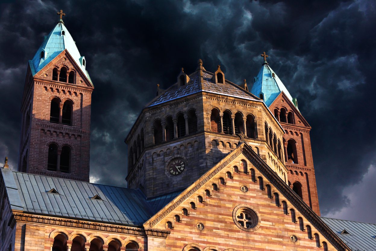The red sandstone east end of Speyer Cathedral, with its octagonal crossing tower and two green-capped towers
