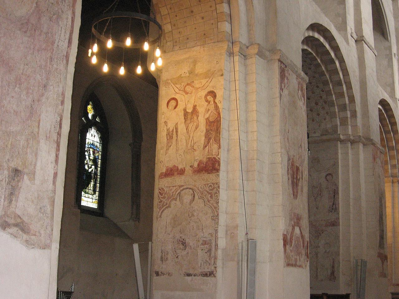 Medieval wall paintings of the Crucifixion on the Norman piers of the nave at St Albans Cathedral