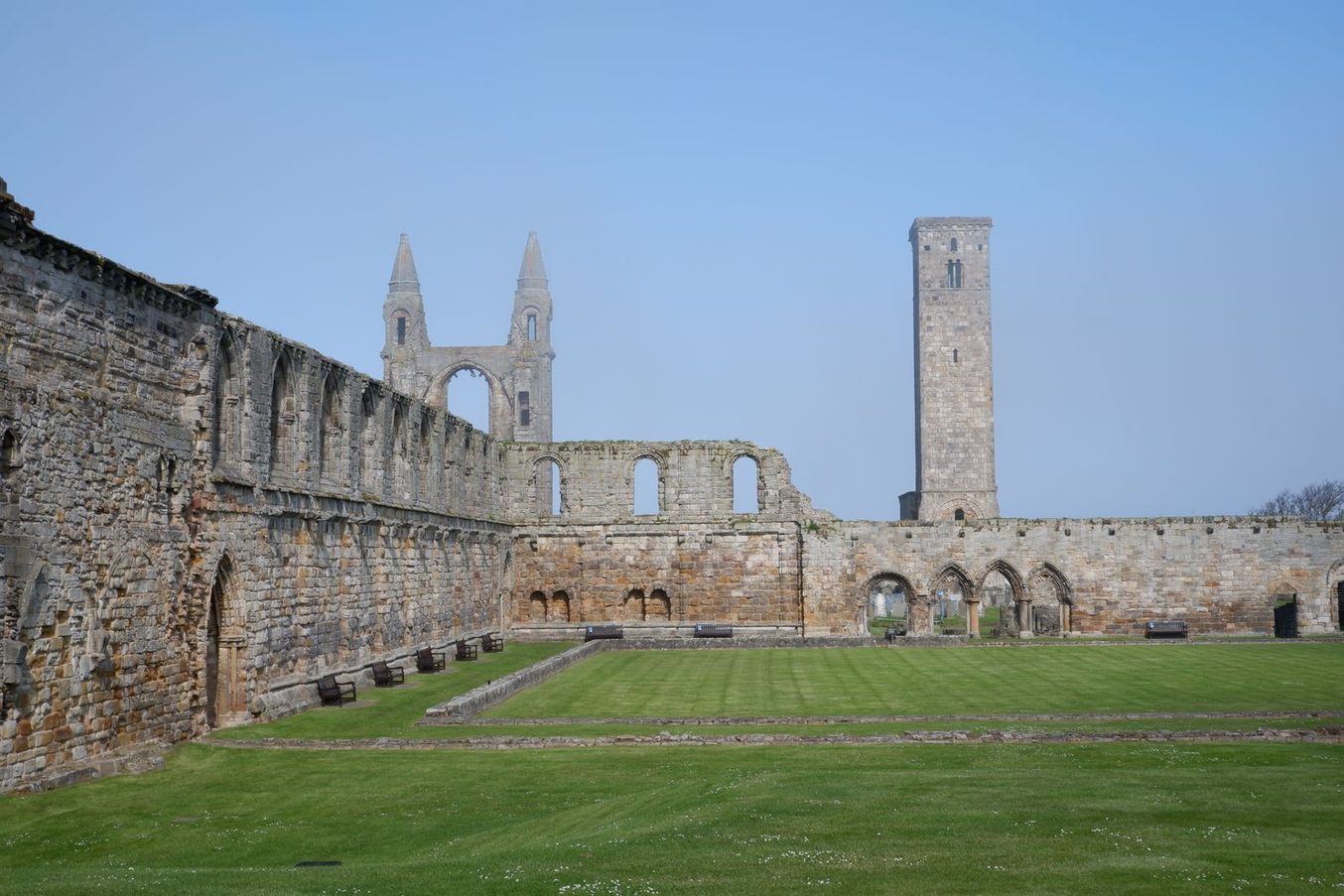 The long south wall of the nave of St Andrews Cathedral with the east gable and St Rule's Tower in the distance