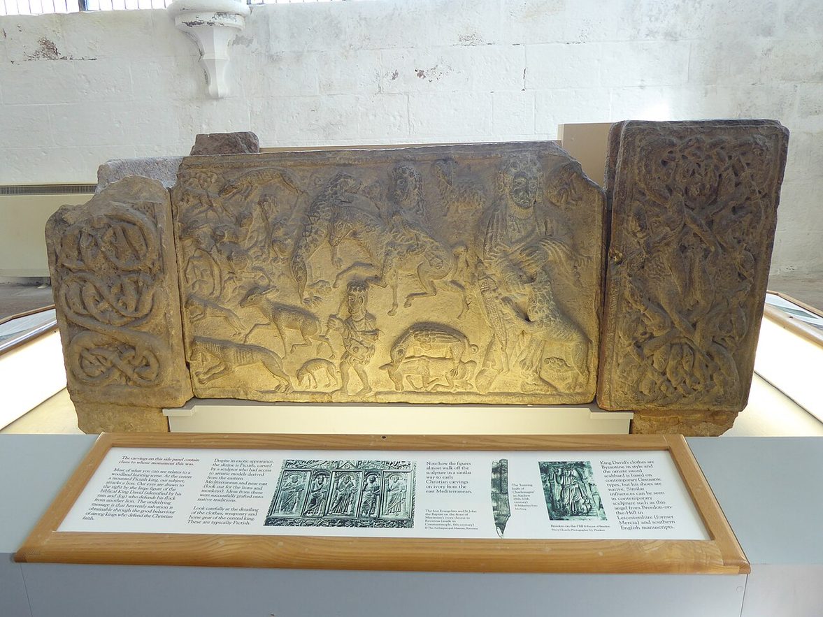 The carved Pictish St Andrews Sarcophagus panel with a figure, a lion and hunting scenes