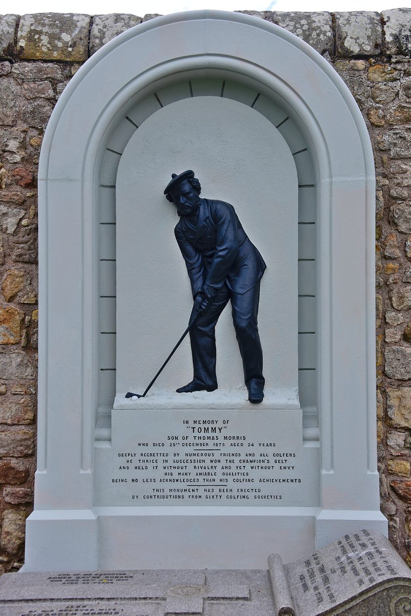 The memorial to the golfer Young Tom Morris in St Andrews Cathedral graveyard, showing him about to drive