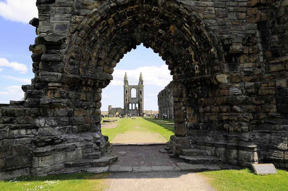 Looking through the ruined west doorway of St Andrews Cathedral along the nave to the east gable