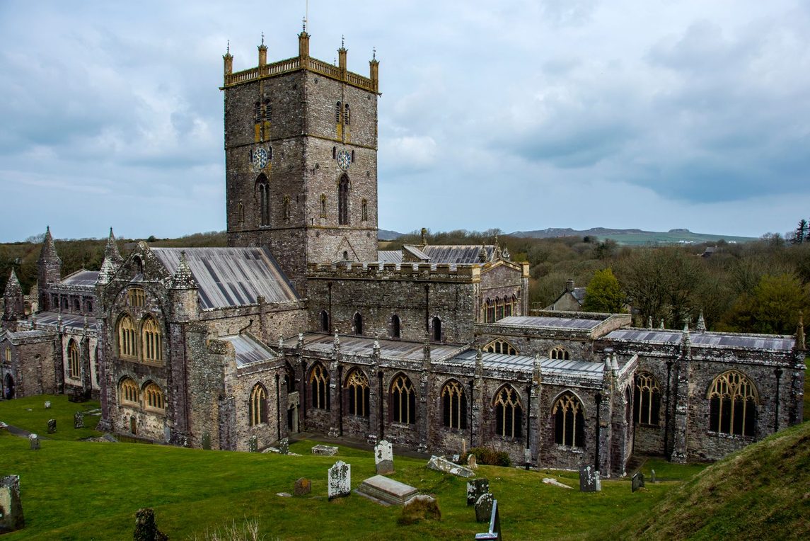 St Davids Cathedral in its hollow below the city of St Davids, Pembrokeshire, seen from above with its central tower