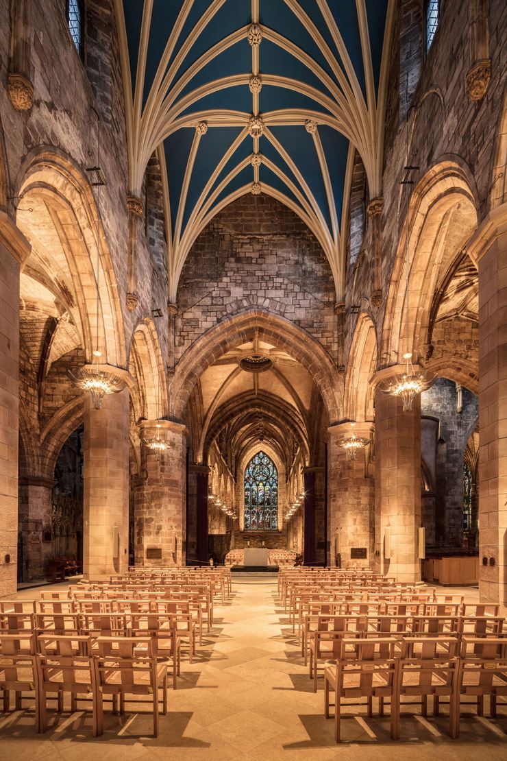 The nave of St Giles' Cathedral with its blue vault and rows of chairs