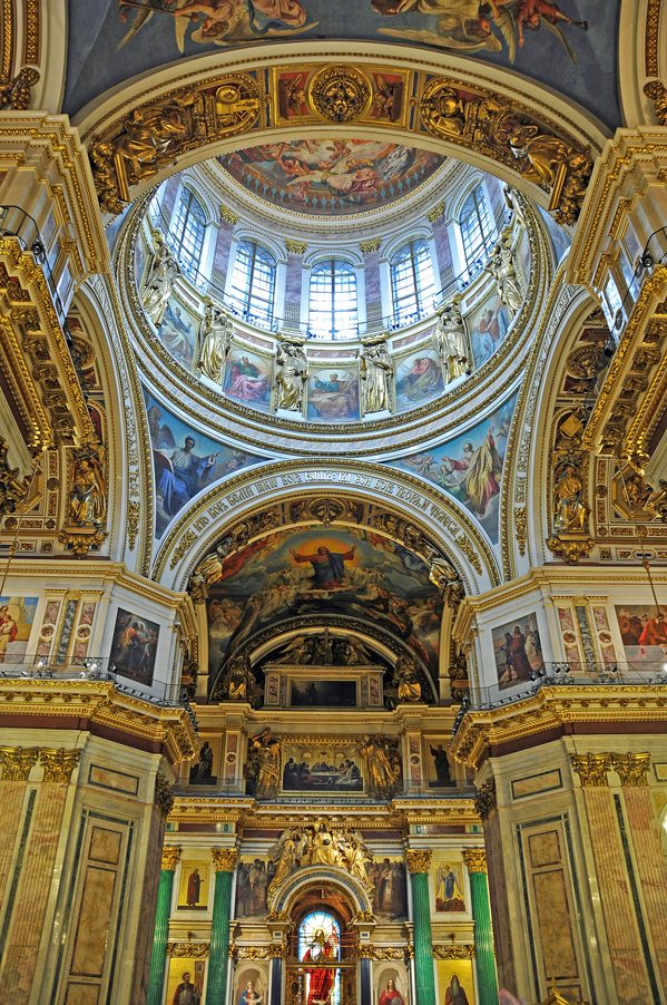 The gilded and painted interior of St Isaac's Cathedral, looking up into the dome towards the iconostasis