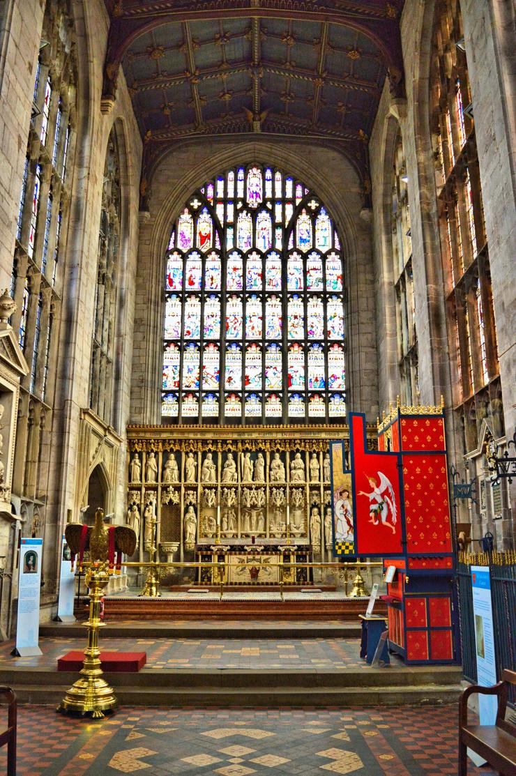 The chancel of St Laurence's with its choir stalls and great east window