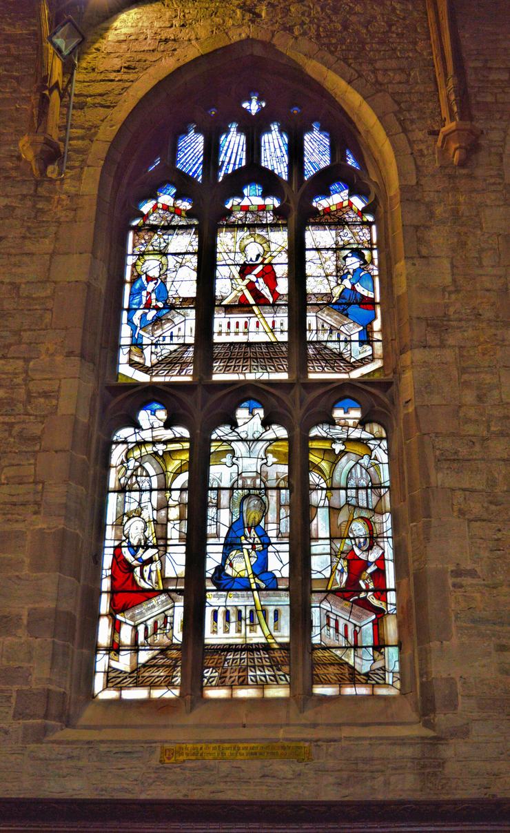 A stained glass window with figures in St John's Chapel, the Palmers' Guild chapel at St Laurence's, Ludlow