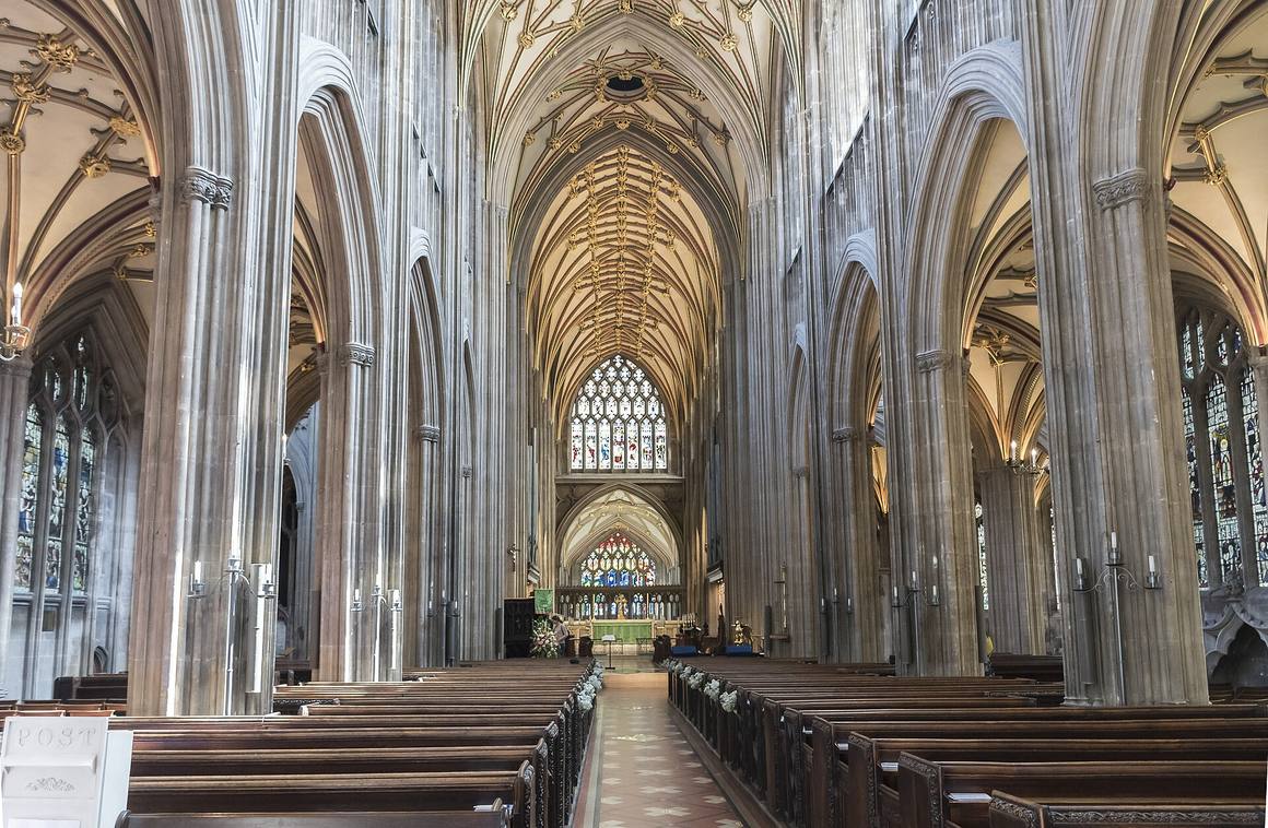 The tall stone-vaulted nave of St Mary Redcliffe looking east