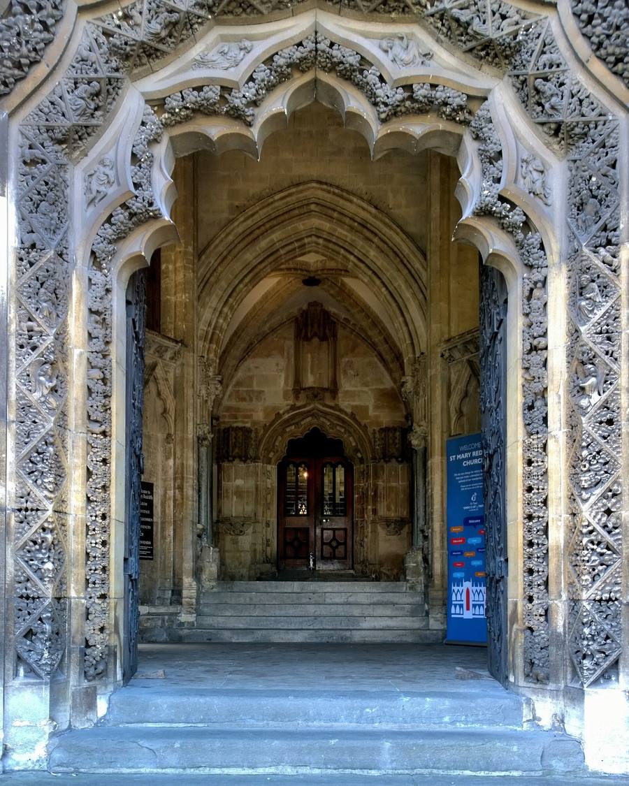 Looking through the deeply carved doorway of the north porch into the church