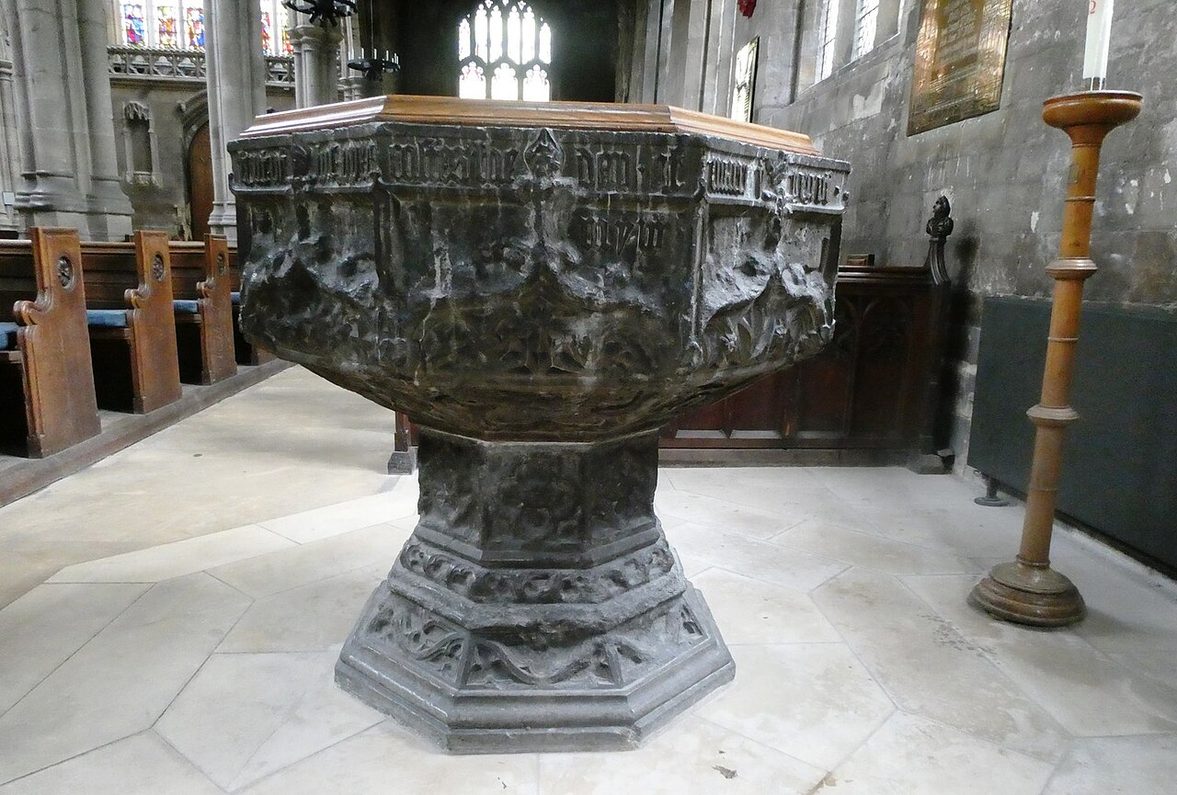 The dark marble font of St Mary's Church, Beverley, an octagonal bowl on a carved stem