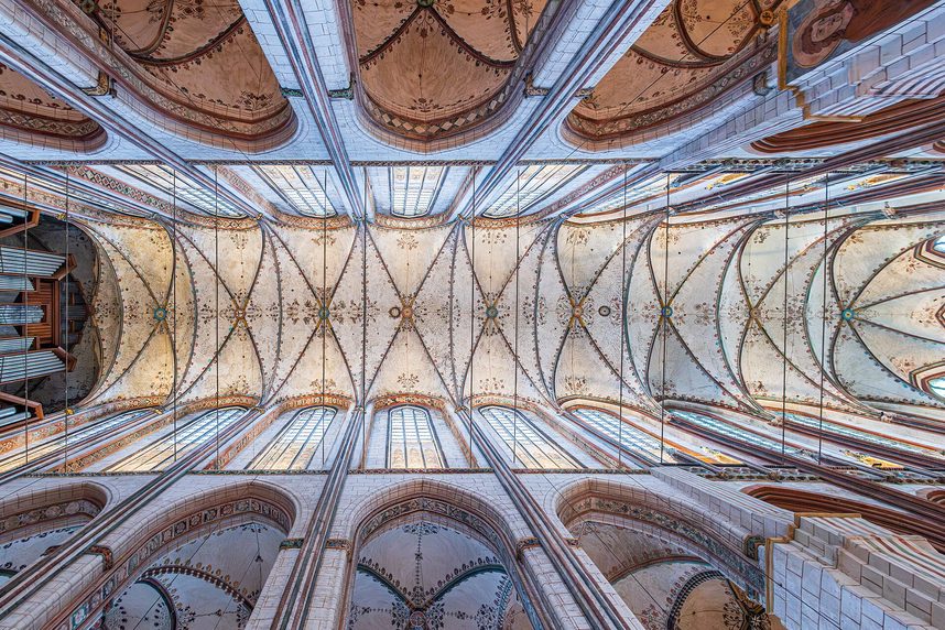 Looking straight up at the painted rib vaults of the nave of St Mary's Church in Lübeck