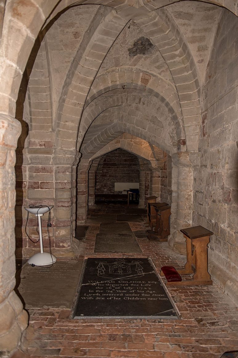 The vaulted Norman crypt of St Mary's, Warwick, with its round arches and stone floor