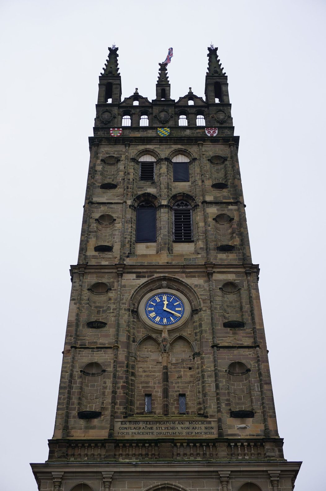 The tall pinnacled tower of the Collegiate Church of St Mary, Warwick, rising above the west end of the church