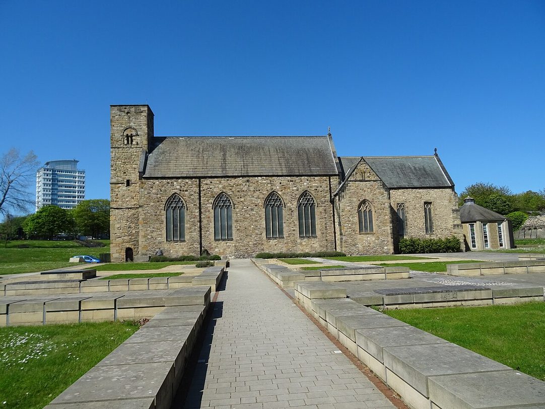 The south side of St Peter's Church, Monkwearmouth, with the outlines of the monastery buildings marked out in the churchyard