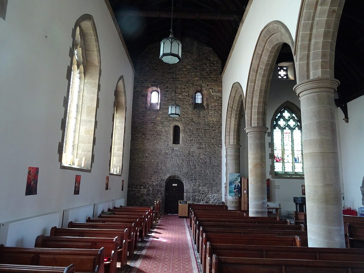 Inside St Peter's Church, Monkwearmouth, looking west along the nave to the tall rough-stone Anglo-Saxon west wall