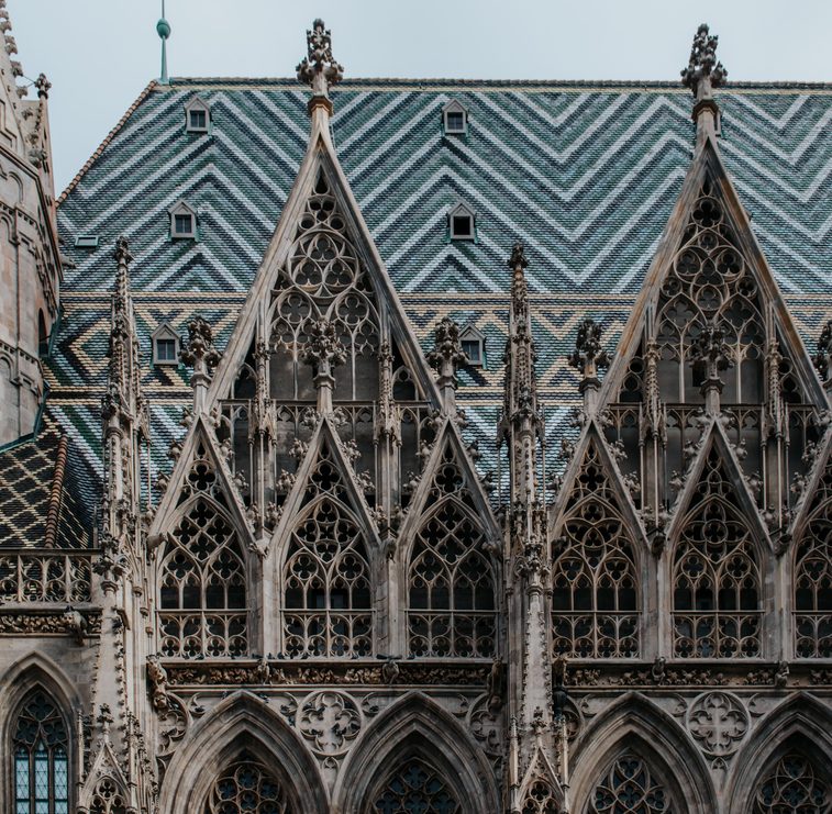 Close view of the Gothic gables and pinnacles along the side of St Stephen's Cathedral under the tiled roof